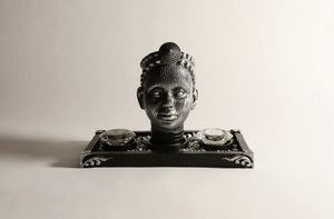 Olokun Head Platinum Silver Ornament with black and silver tinted decorative tray.